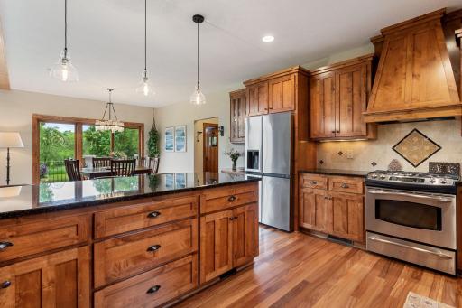 Spacious kitchen with knotty alder custom cabinets