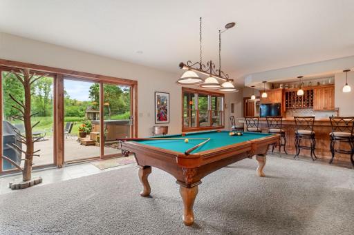 Walk out to a large patio with a Marquis hot tub