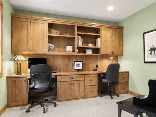 Office on the main floor with custom built in cabinets