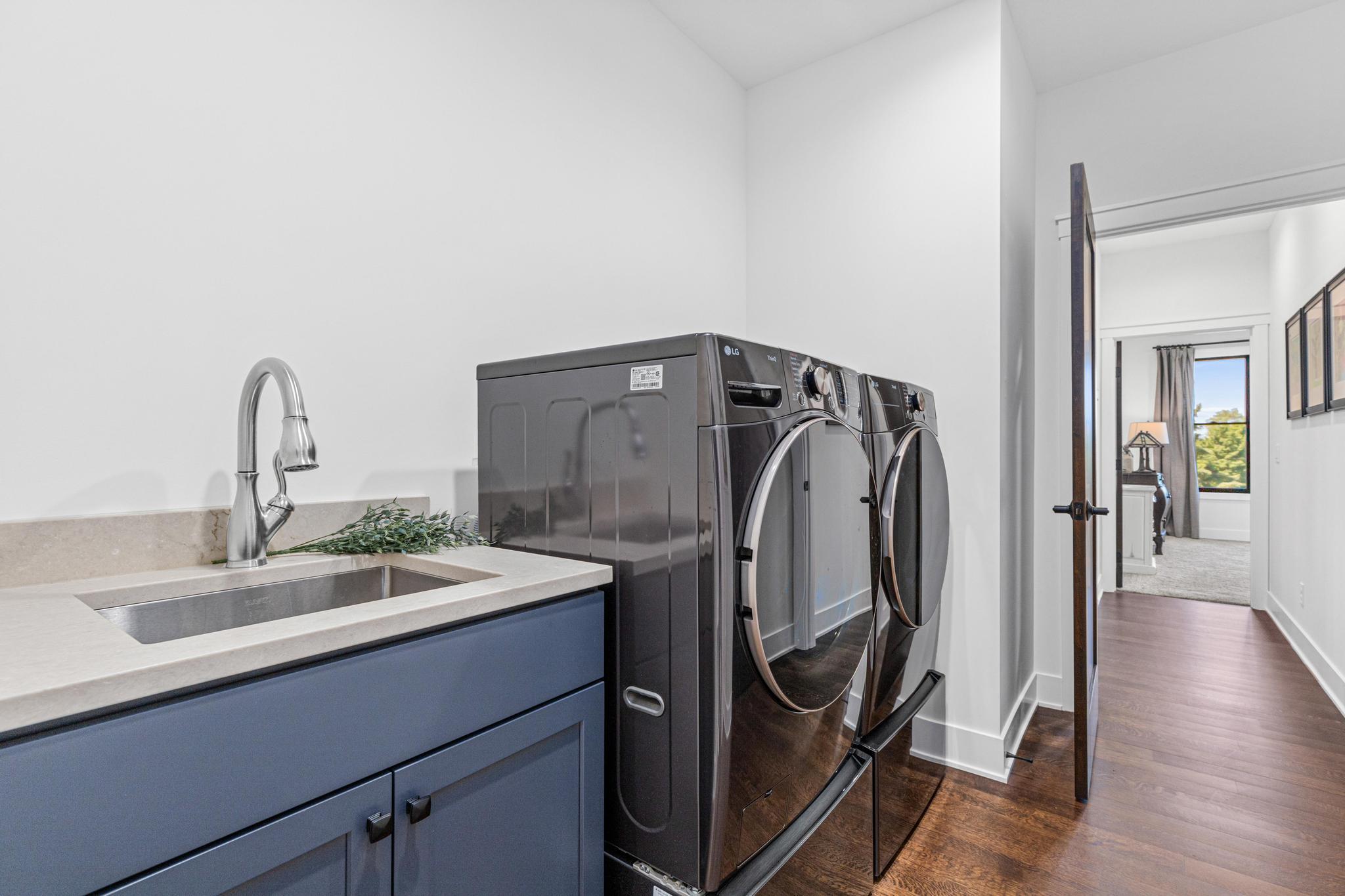 Main floor laundry makes chores a snap- conveniently located near the owner's suite.