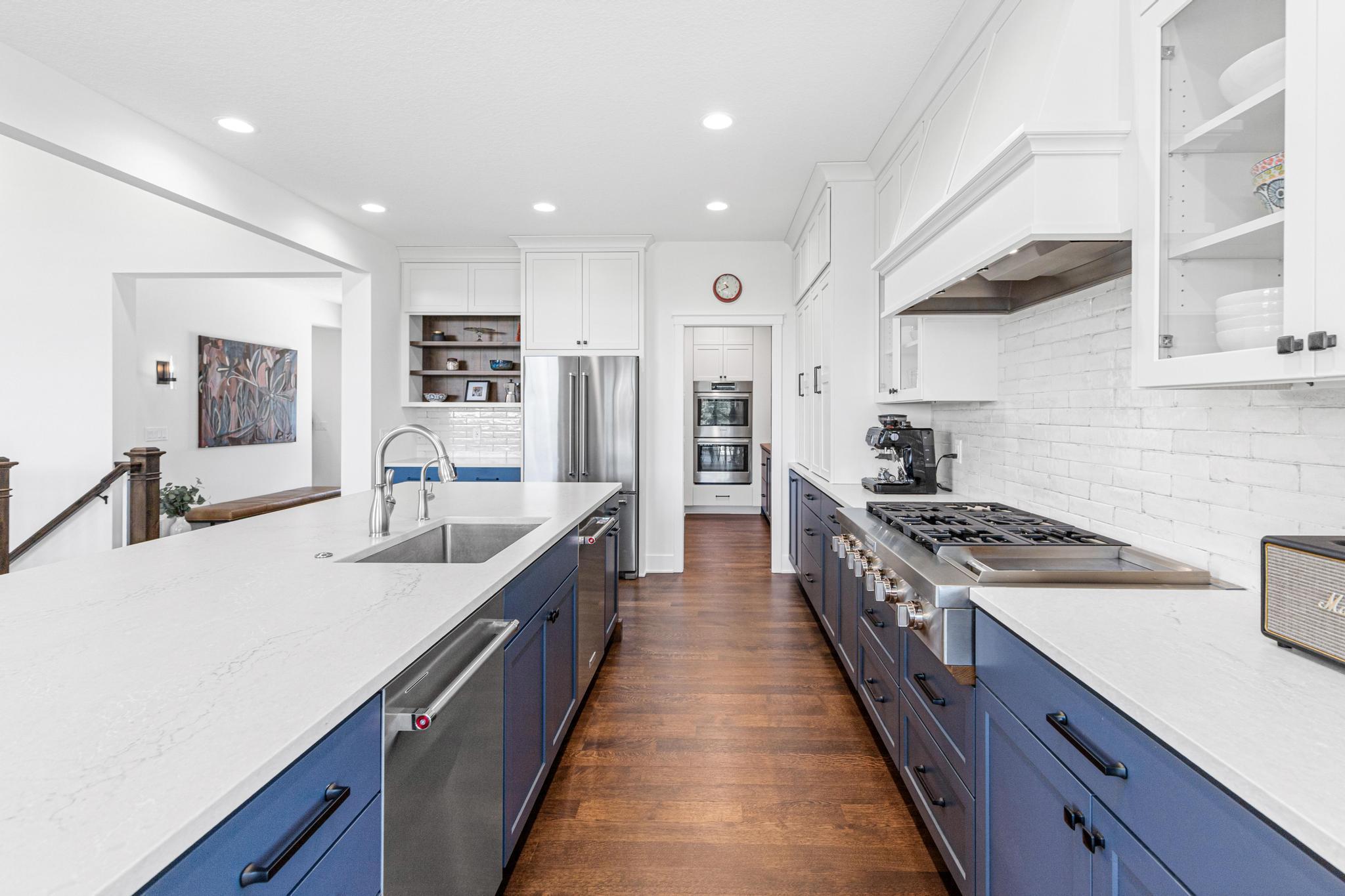 Abundant counter space and cabinetry allow for many cooks in the kitchen at once- fantastic butler pantry houses all of the ingredients and keeps the counters clean and neat.