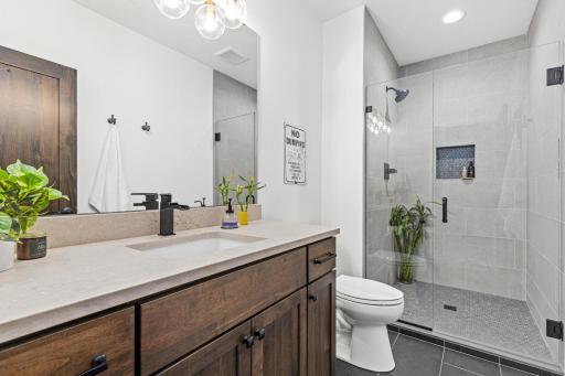 Beautifully appointed en-suite bathroom provides convenience and privacy.