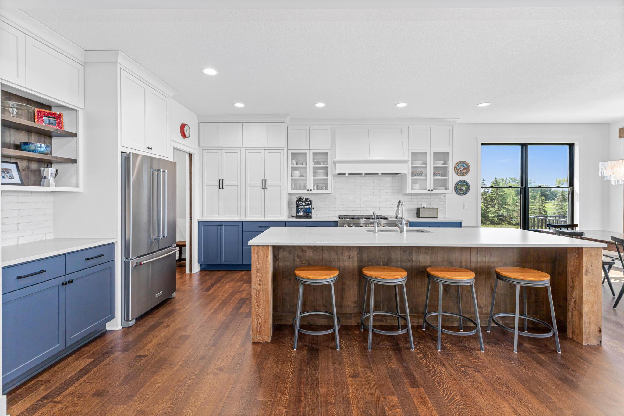 High-end appliances, custom cabinetry, and stunning design details make this kitchen as functional as it is beautiful.
