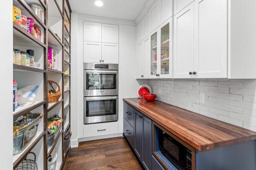 The spacious butler's pantry provides exceptional storage, prep space, and organization for effortless entertaining.