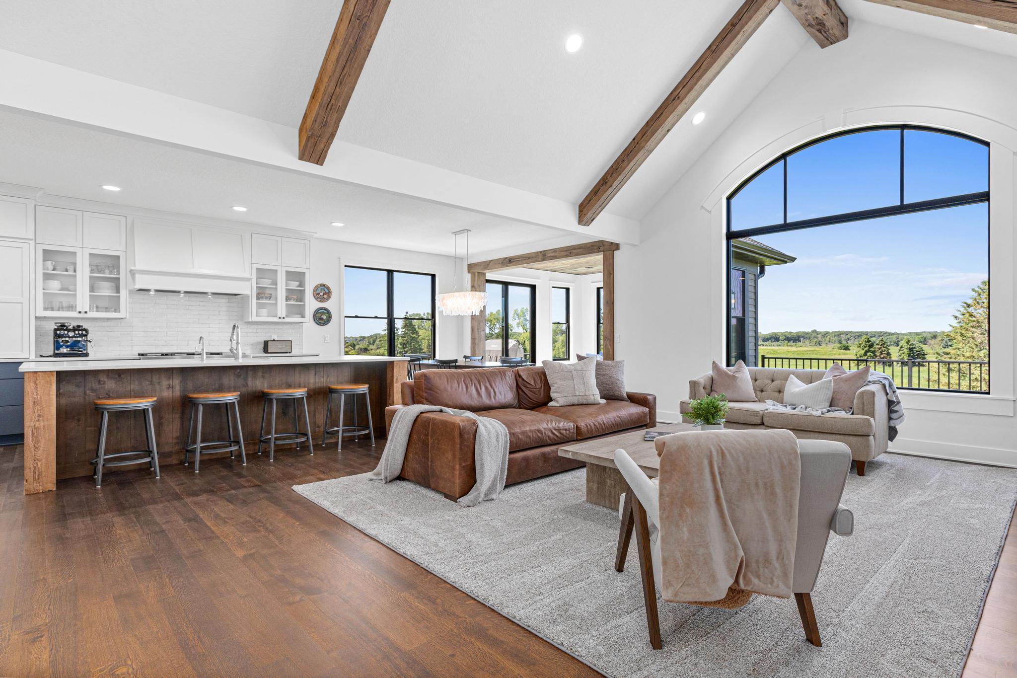 Every window brings the outdoors in, while rich hardwood floors, custom cabinetry and solid surface countertops provide beautiful materials to last a lifetime.