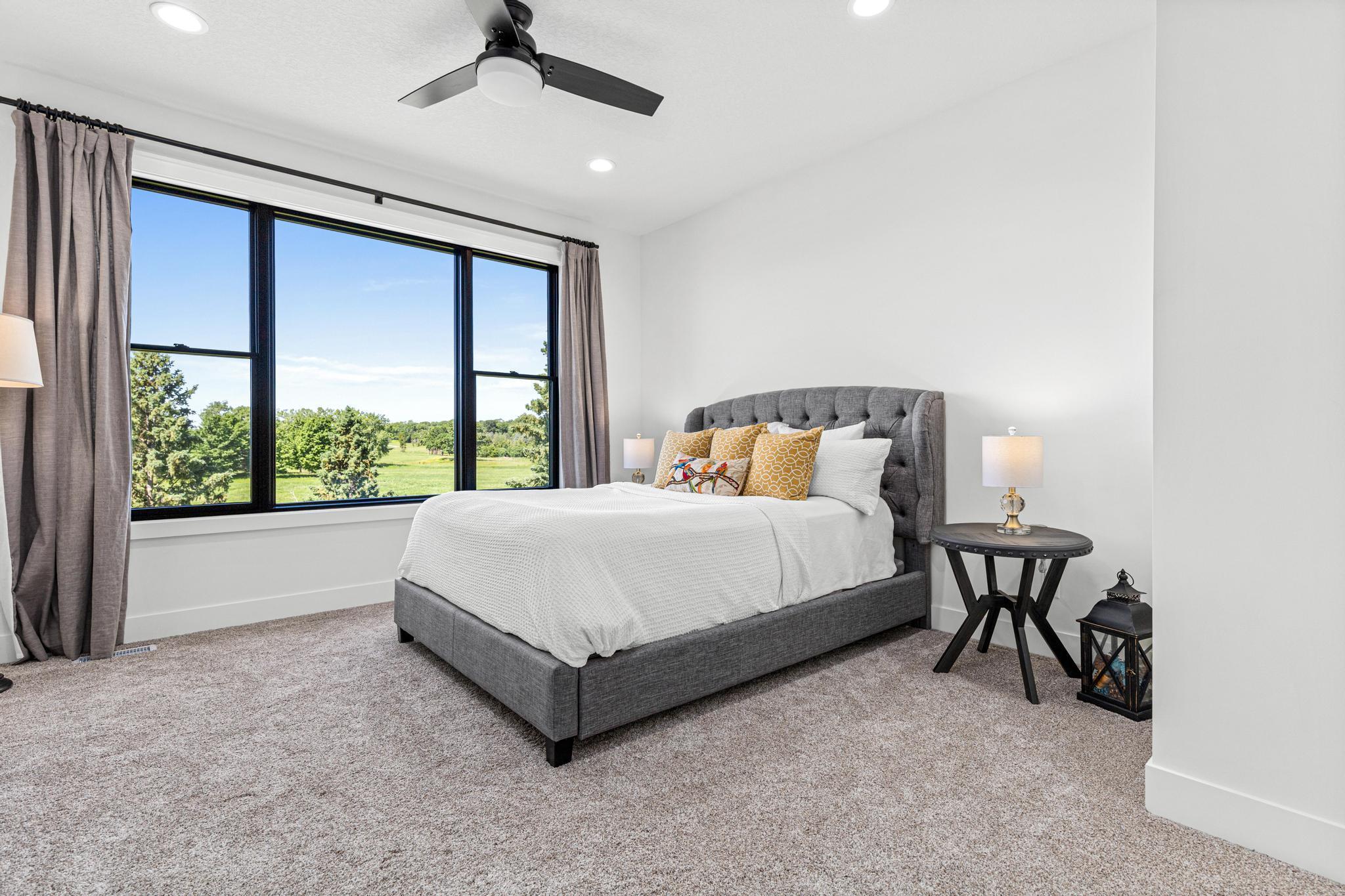 Wake each morning to sweeping views of meadows, mature trees, and rolling green space.