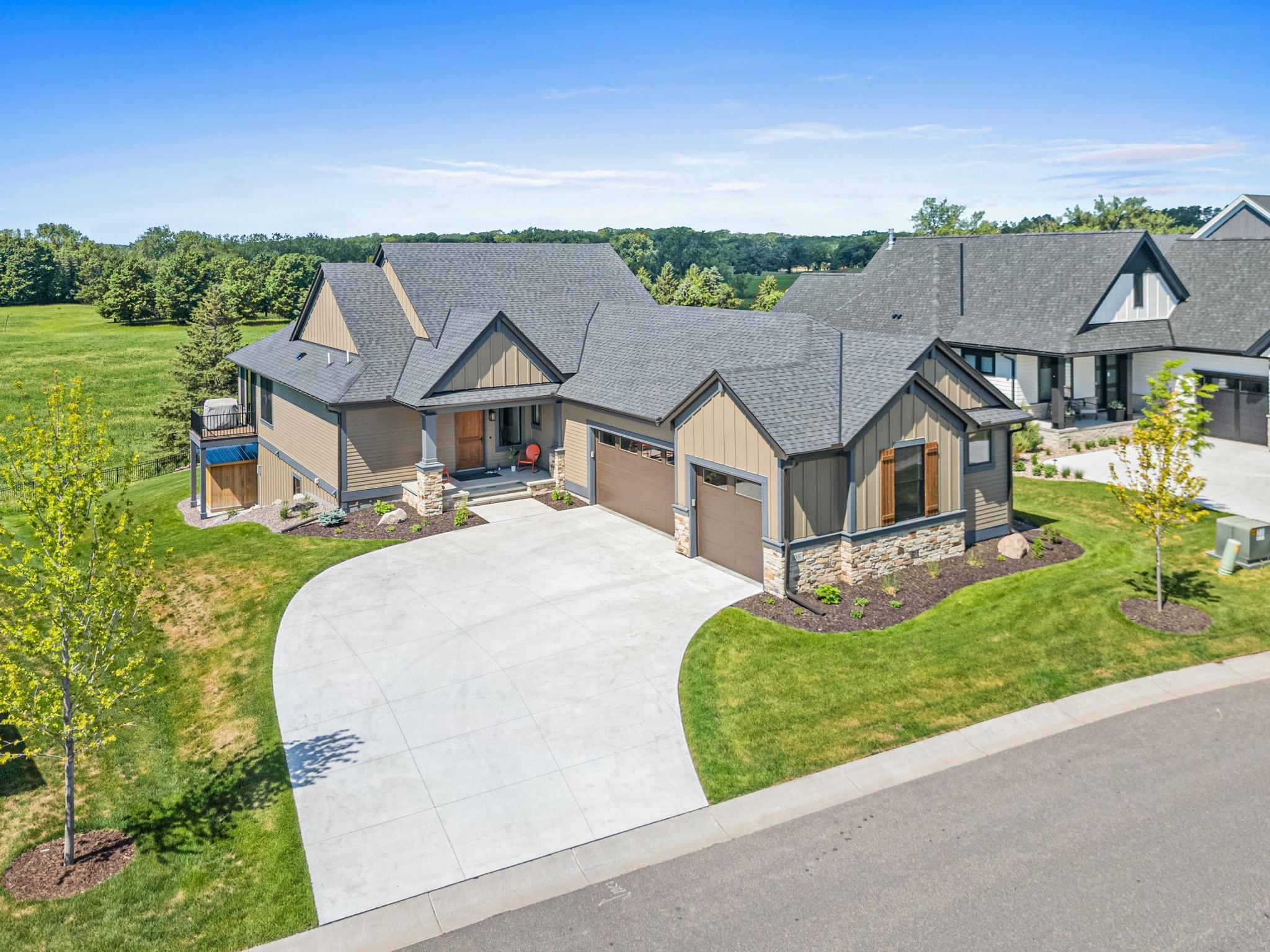 Designed with the landscape in mind, this home captures the incredible views and feels very private. One-level living with a finished lower level is perfect for those looking to simplify their life.