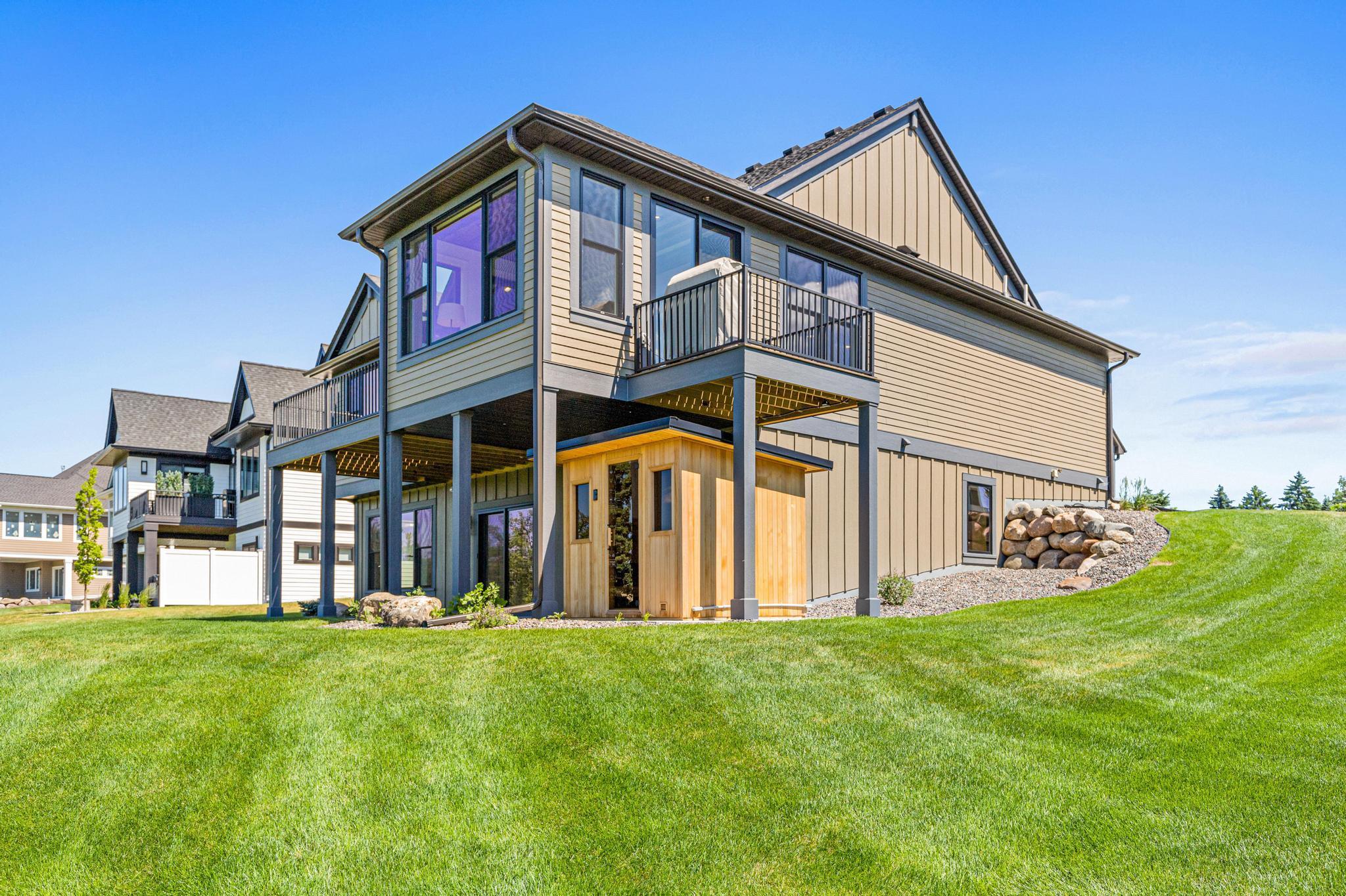 Side view of the home showing the beautiful architectural details and private spaces. This home is ready to be enjoyed all seasons of the year.