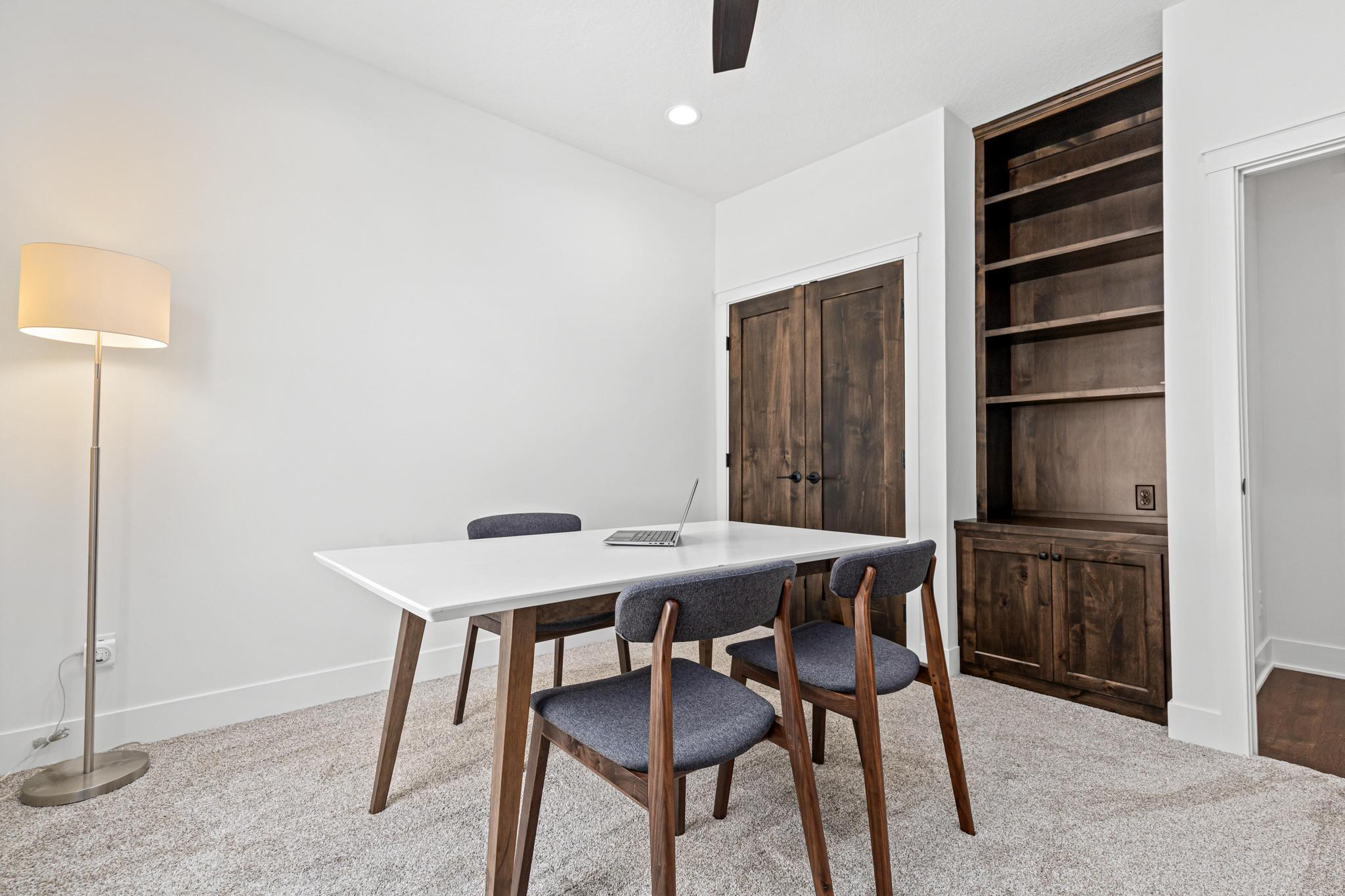 Privately tucked away from the main living areas, this bedroom/office provides the ideal work-from-home environment.