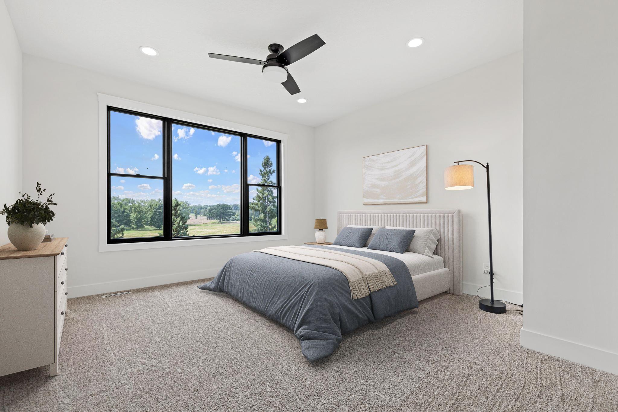 Wake each morning to sweeping views of meadows, mature trees, and rolling green space. Visually staged.