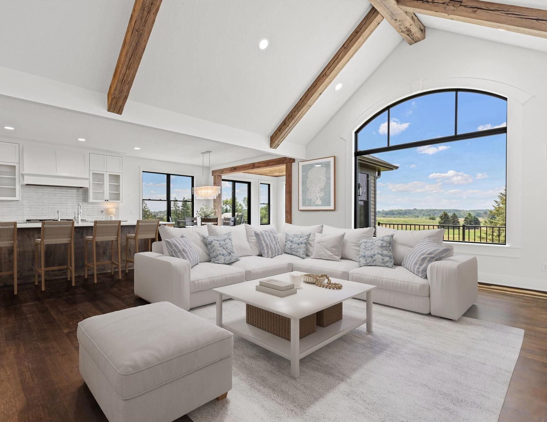 Designed for gathering and entertaining, the expansive main living area seamlessly connects indoor comfort with outdoor beauty. Visually staged.