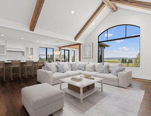Designed for gathering and entertaining, the expansive main living area seamlessly connects indoor comfort with outdoor beauty. Visually staged.