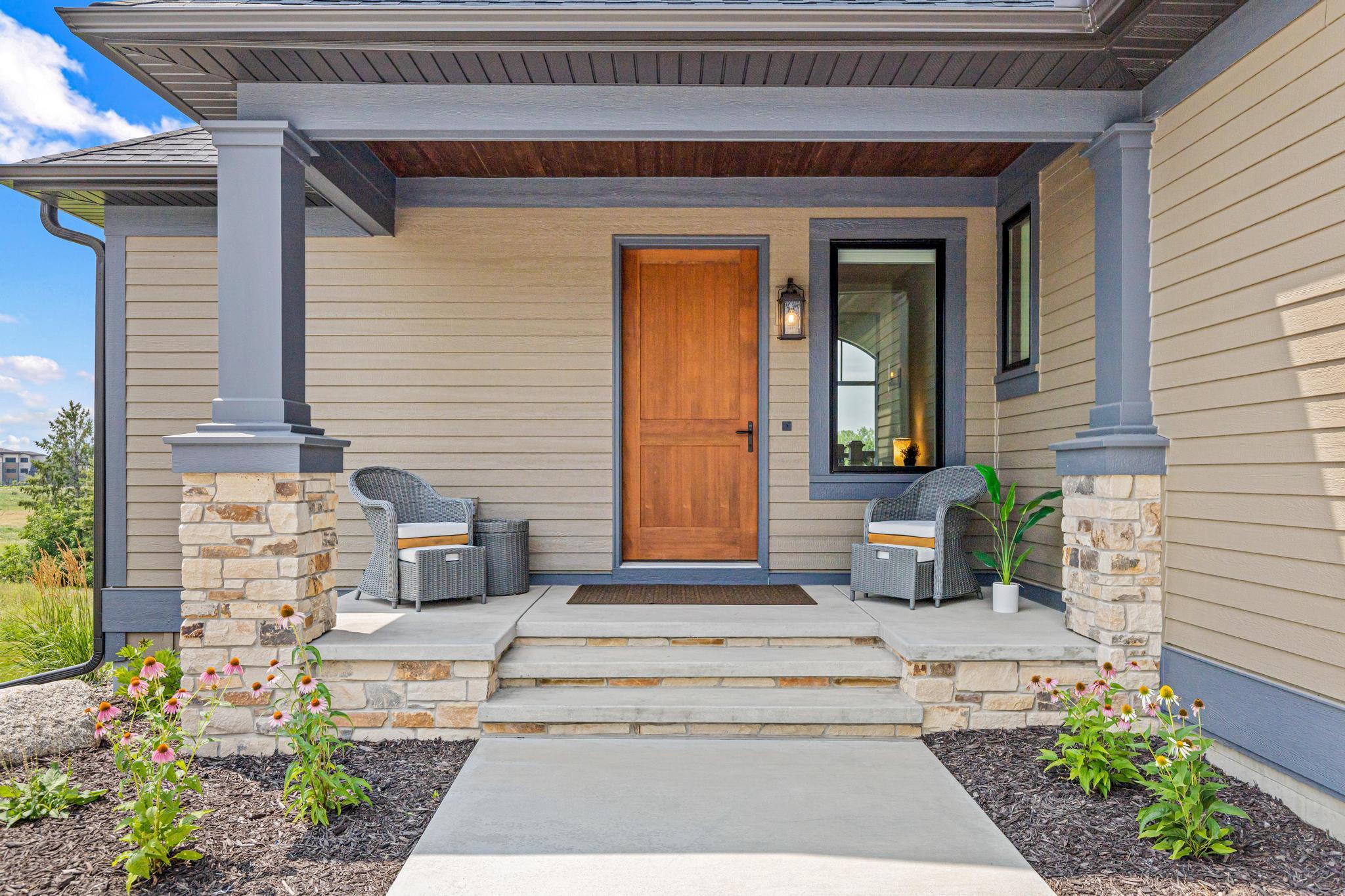 Charming front porch welcomes friends and visitors. A great place to enjoy your morning coffee or chat with neighbors.