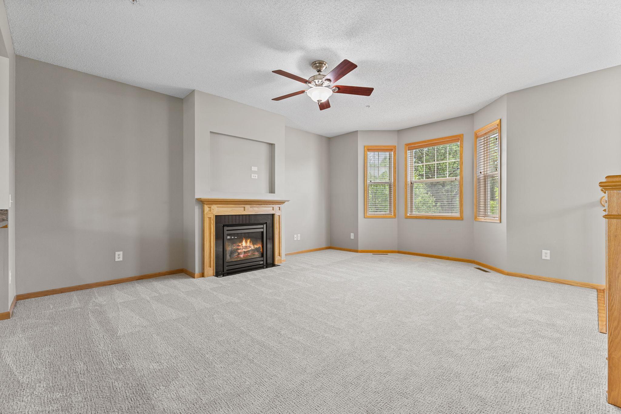 On the middle level enjoy this spacious Living room just off the kitchen, with gas fireplace.