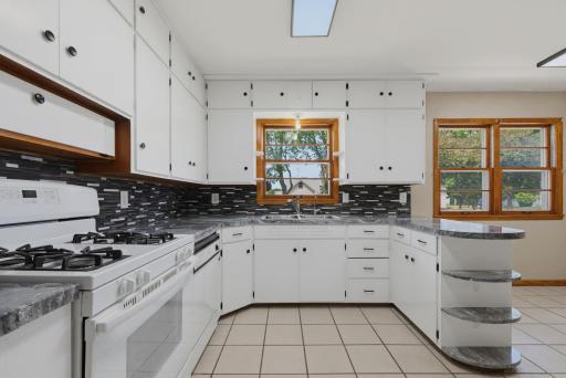 Storage is abundant with plenty of kitchen cabinet space! Appliances include a gas range and a dishwasher.