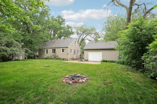 Rear view of home and note the fire pit area.