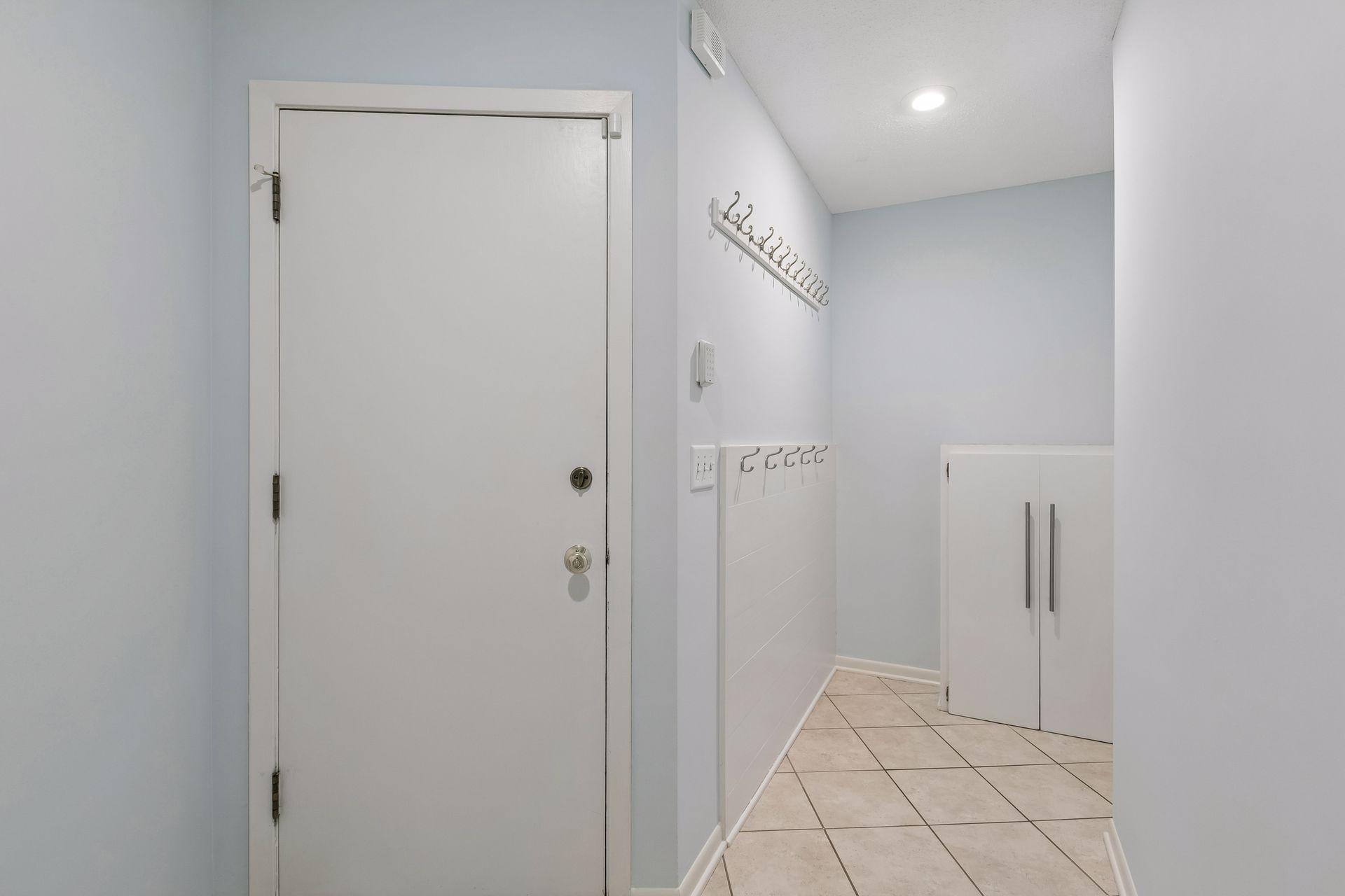 Convenient garage-to-mudroom entry keeps daily life organized.