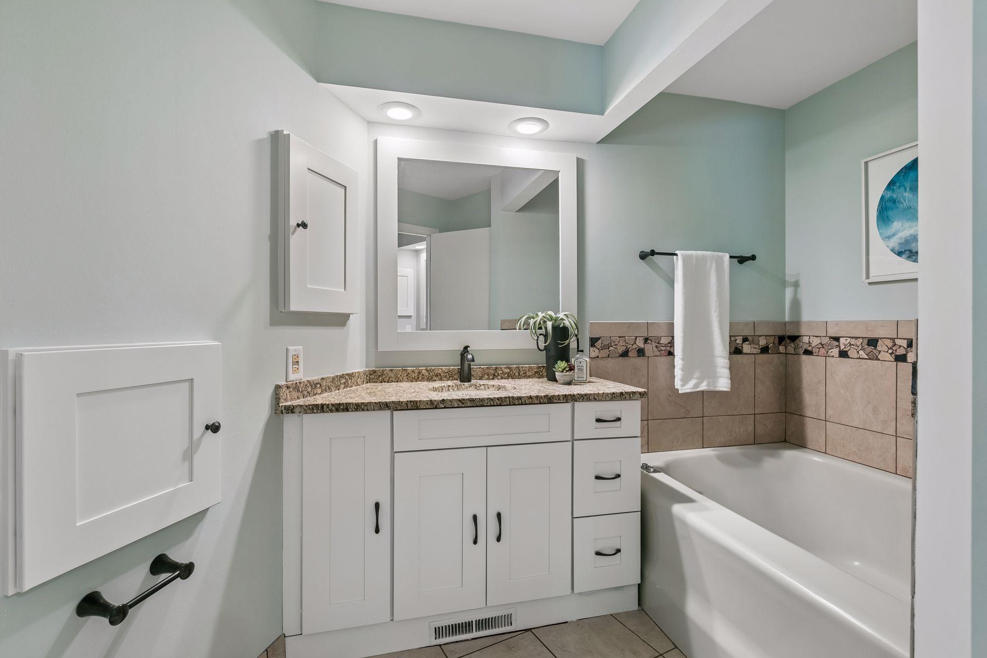 Private bath features a separate tub and shower.
