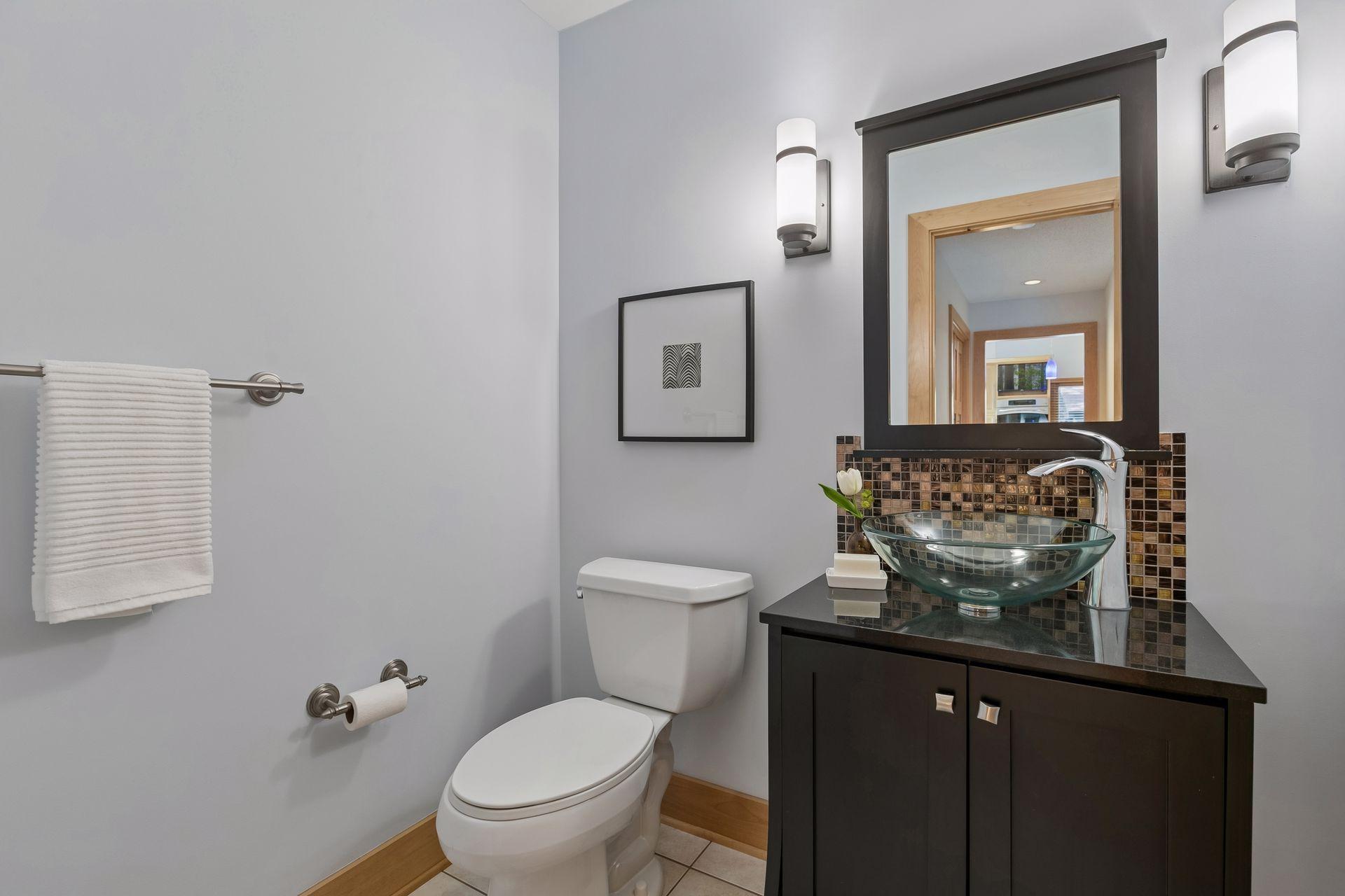 A convenient main floor half bath adds everyday ease and convenience.