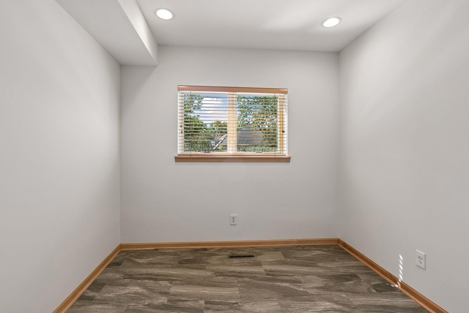 Lower-level fifth bedroom offers added flexibility.