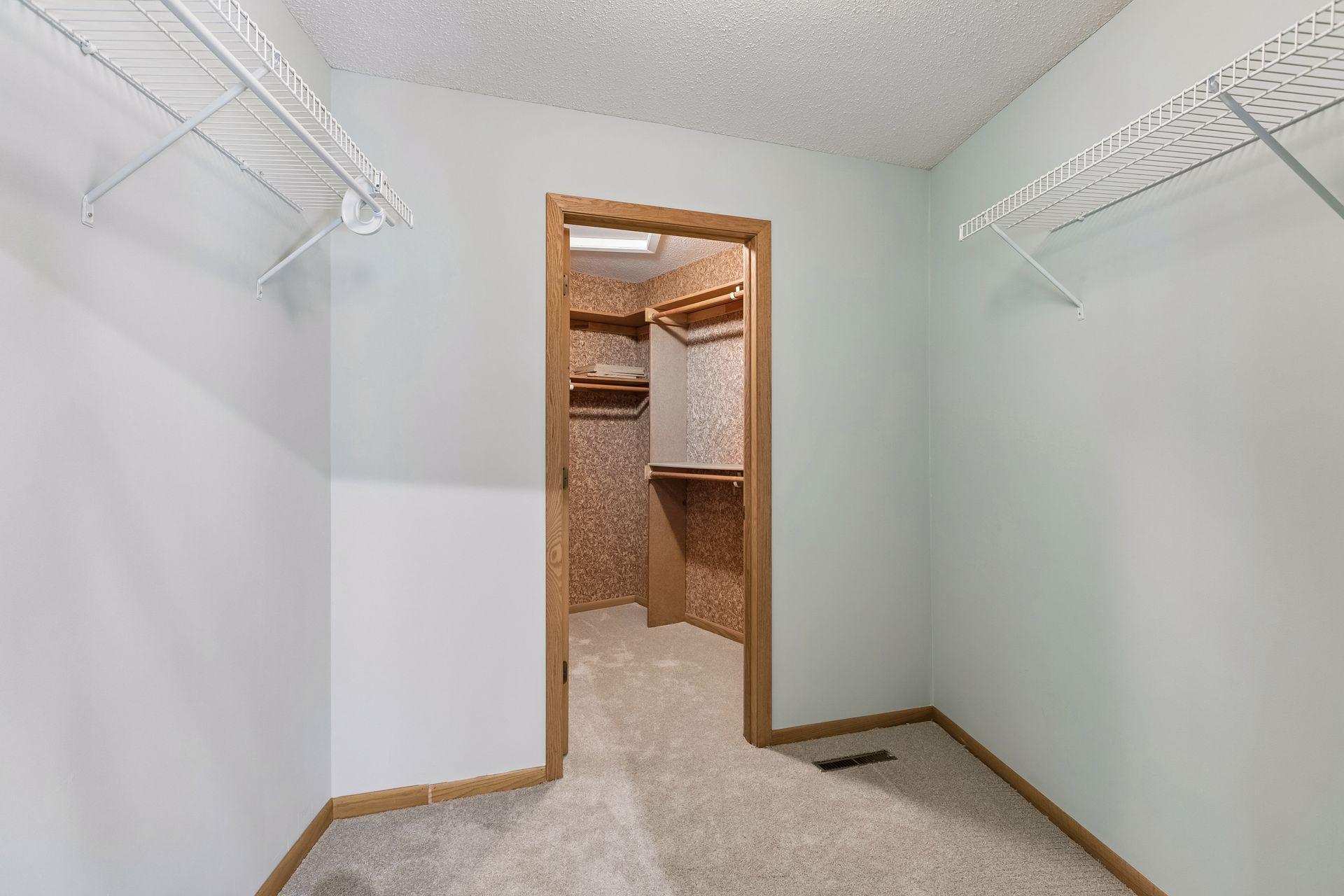 Generous walk-in closet with room to spare.
