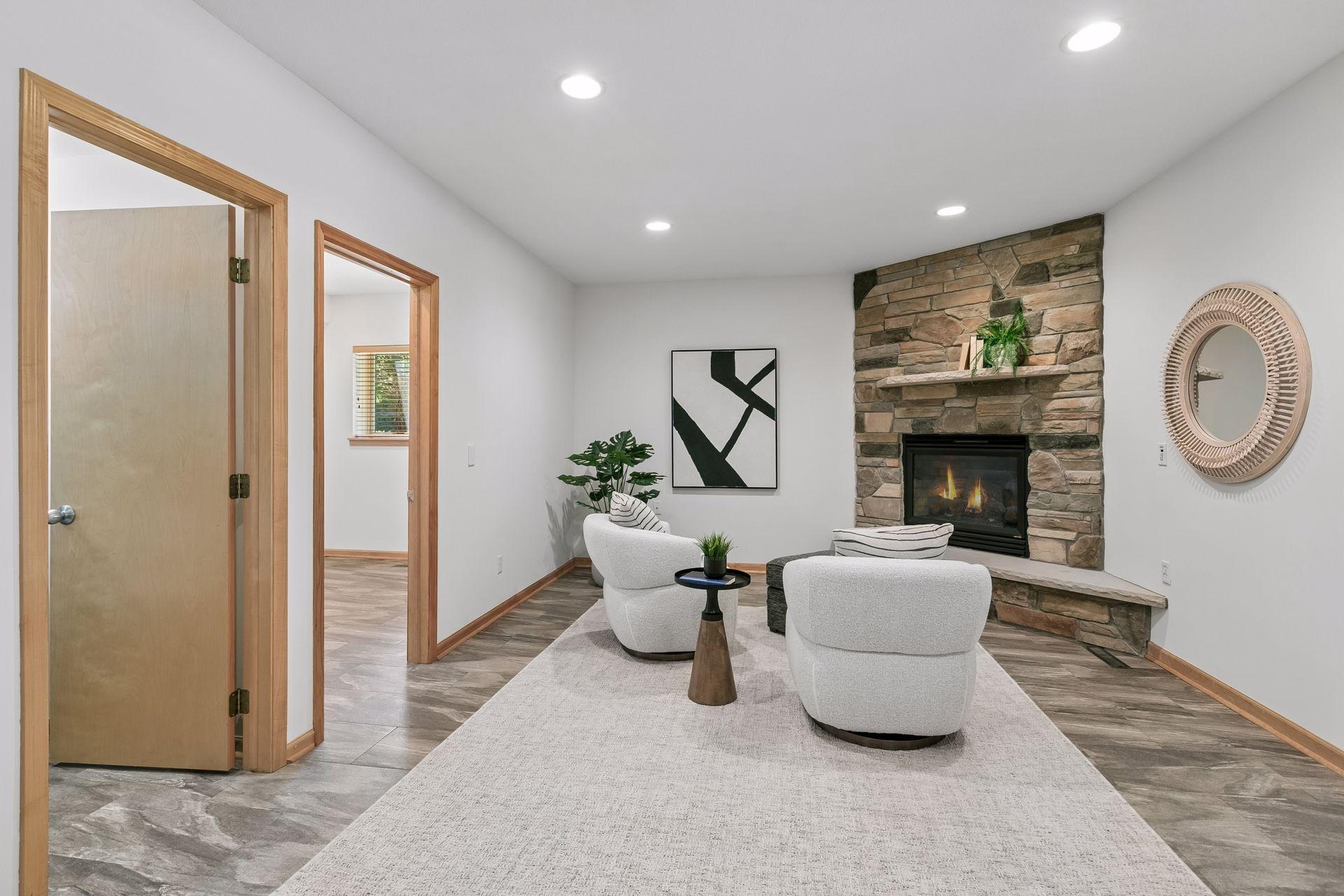 Inviting lower-level family room with gas fireplace.