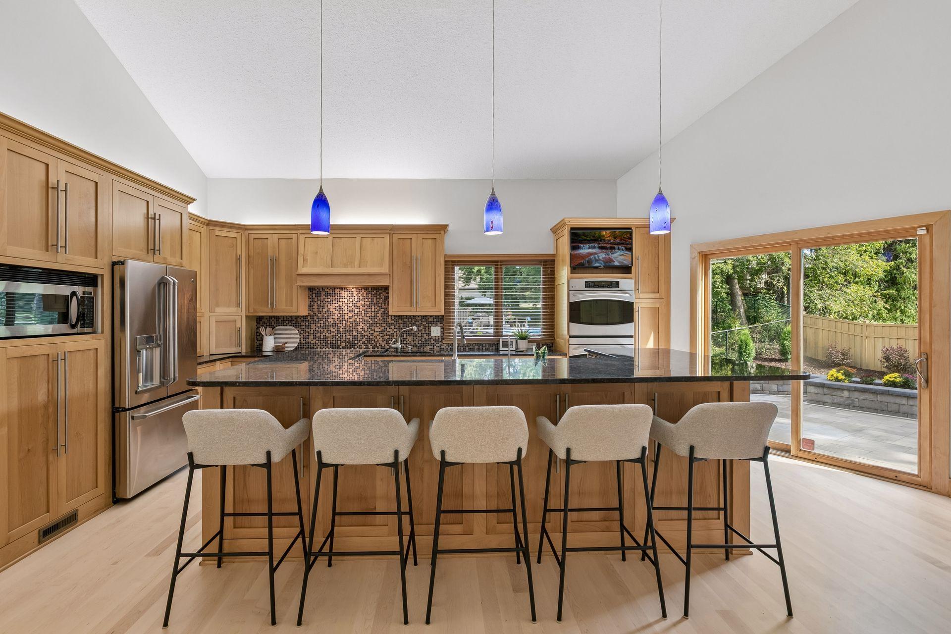 Stainless steel appliances and easy access to the outdoor patio.