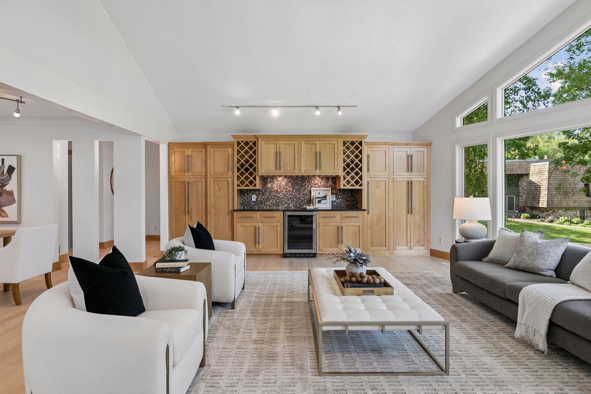 Built-in beverage bar adds charm and function to this inviting gathering space.