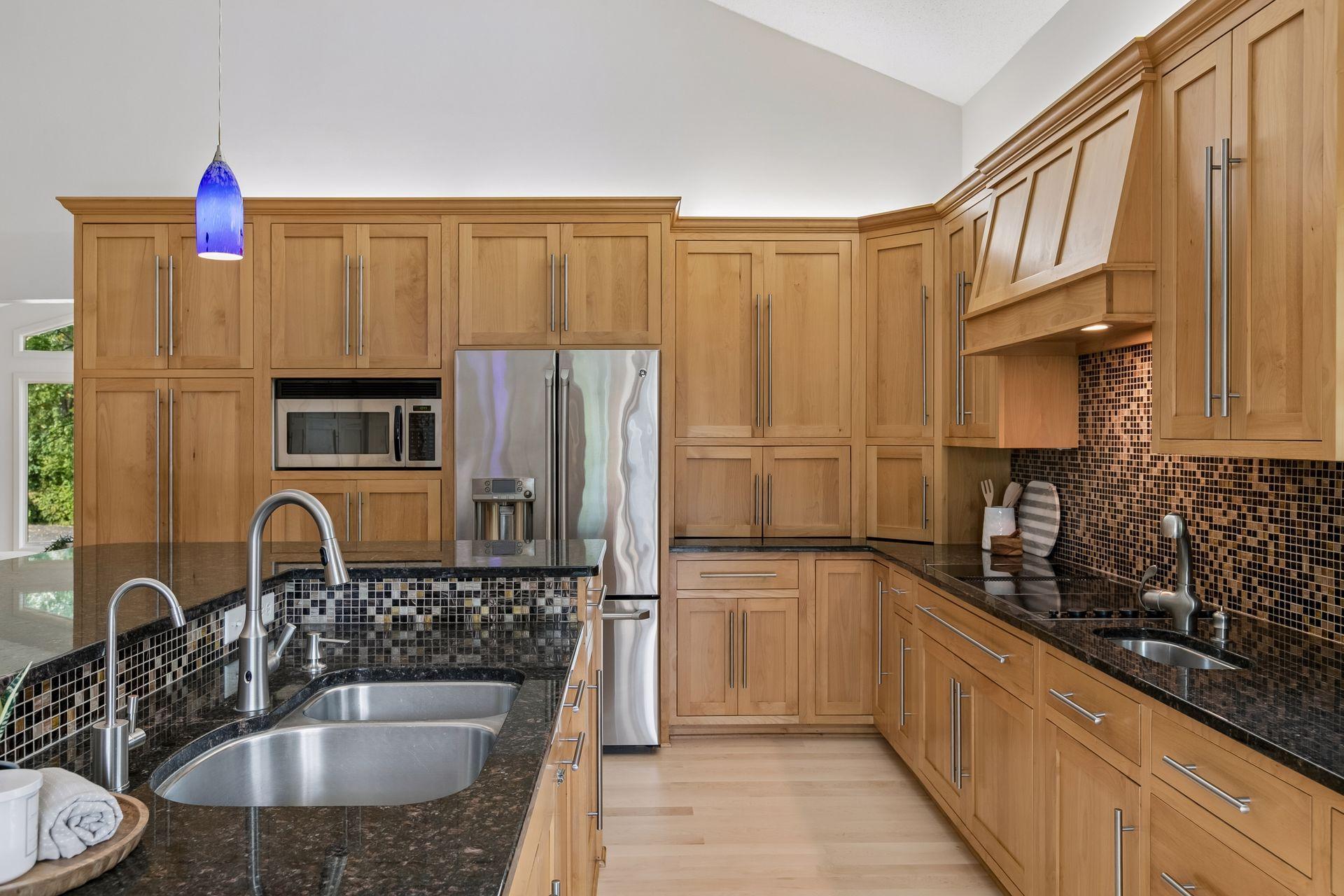 Well-appointed with double ovens and main and prep sinks.