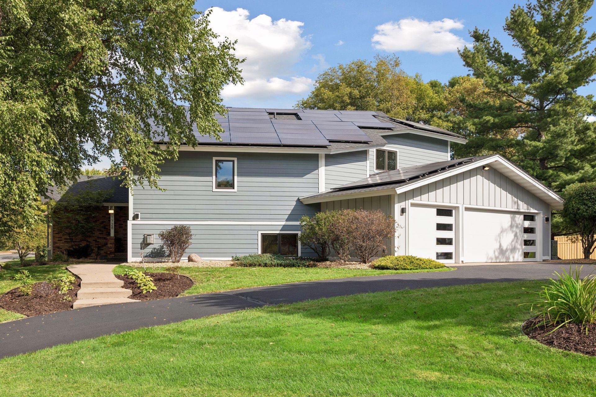 Convenient horseshoe driveway offers easy access and ample parking.