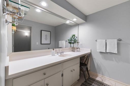 The lower level offers convenient access to a three-quarter bathroom complete with a large vanity and walk-in shower.