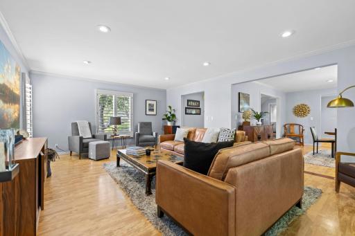 Warm and inviting, this family room features and a front-facing window with peaceful neighborhood views.