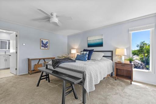 Another perspective of the expansive primary bedroom, designed as a peaceful retreat.