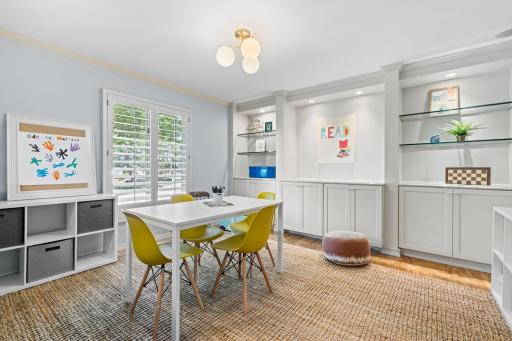 The main level also features an additional front-facing living room, currently utilized as a playroom, offering exceptional flexibility to suit a variety of needs.
