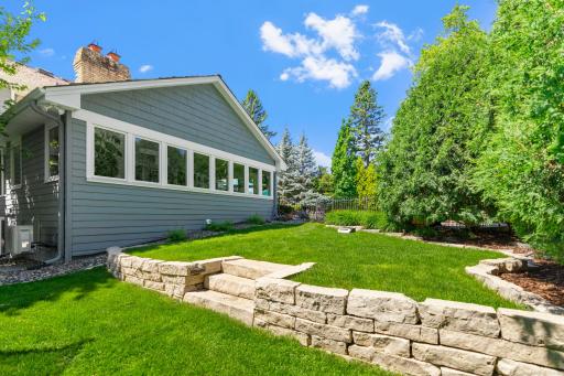 The backyard also features a spacious, separately fenced green area, offering both dedicated entertainment space and room for recreation.