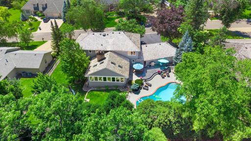 Welcome to a truly one-of-a-kind retreat in the heart of Edina's highly sought-after Parkwood Knolls neighborhood.