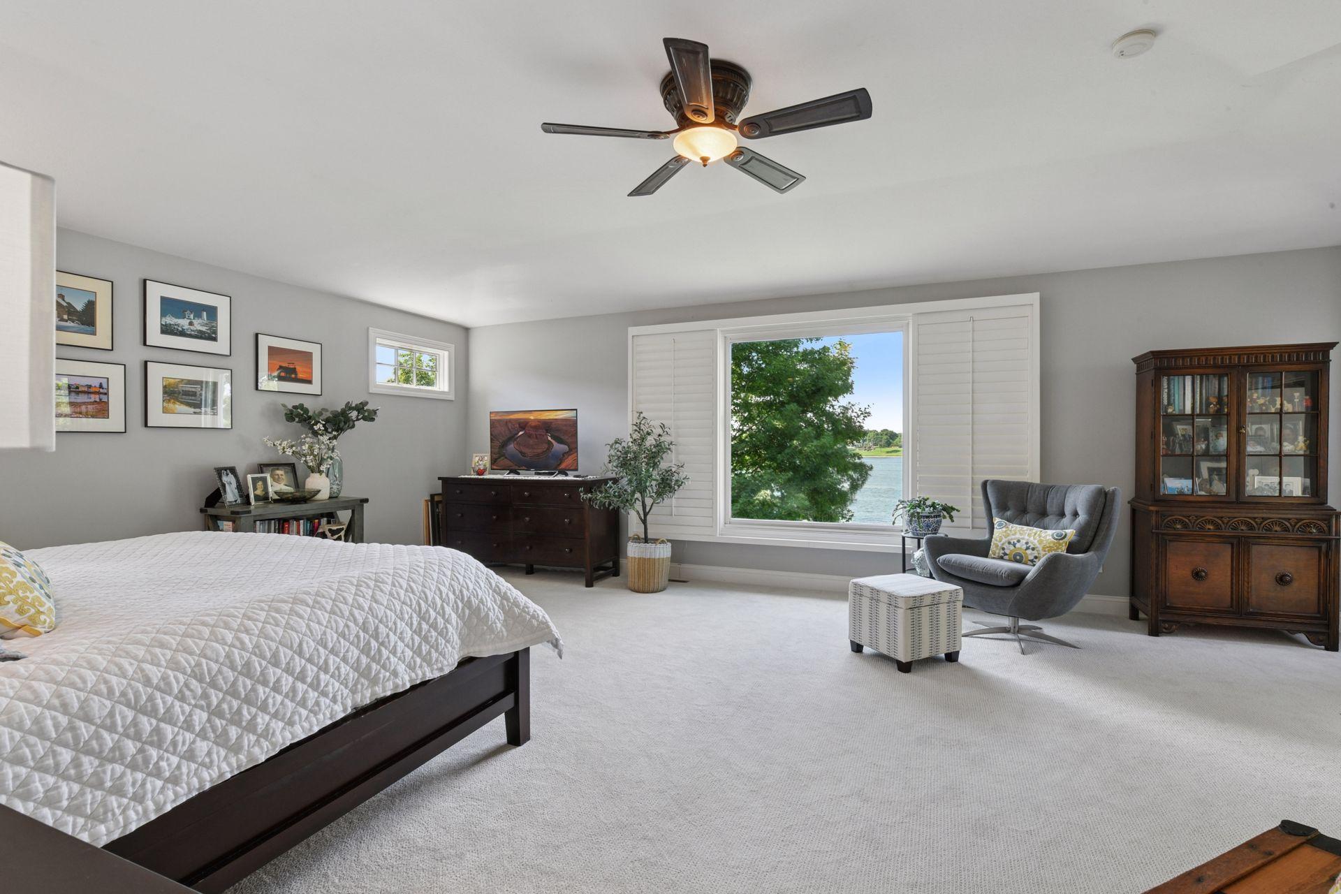 Spacious primary bedroom suite with a amazing lake view