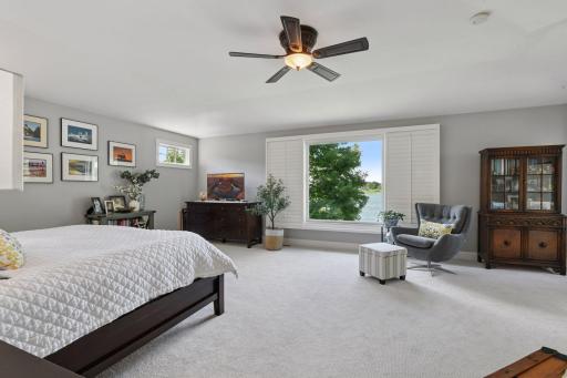 Spacious primary bedroom suite with a amazing lake view