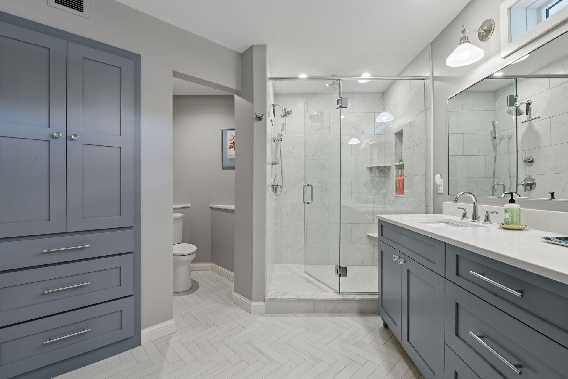 Premium shower & floor tile, new vanity, countertops, lighting and shower system.
