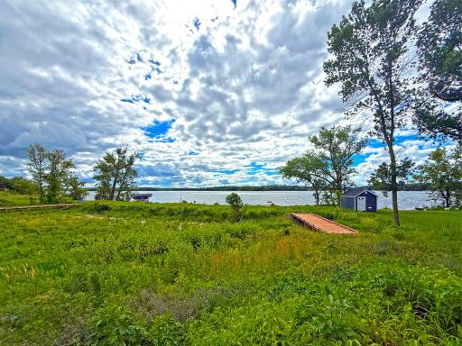 You will fall in love with a picturesque boardwalk leading to over 85 feet of sandy, hard-bottom shoreline, where breathtaking sunsets await each evening.