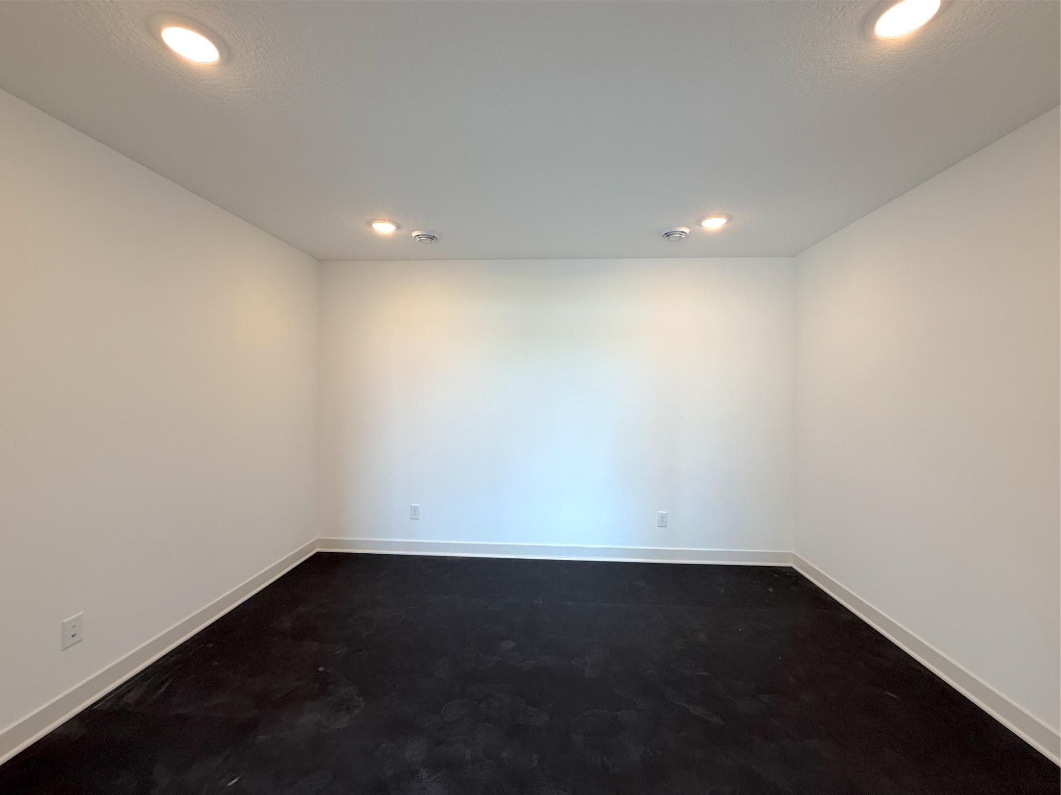 Stay active without leaving home in the dedicated exercise room, featuring French doors, durable rubber flooring and ample space for fitness equipment.
