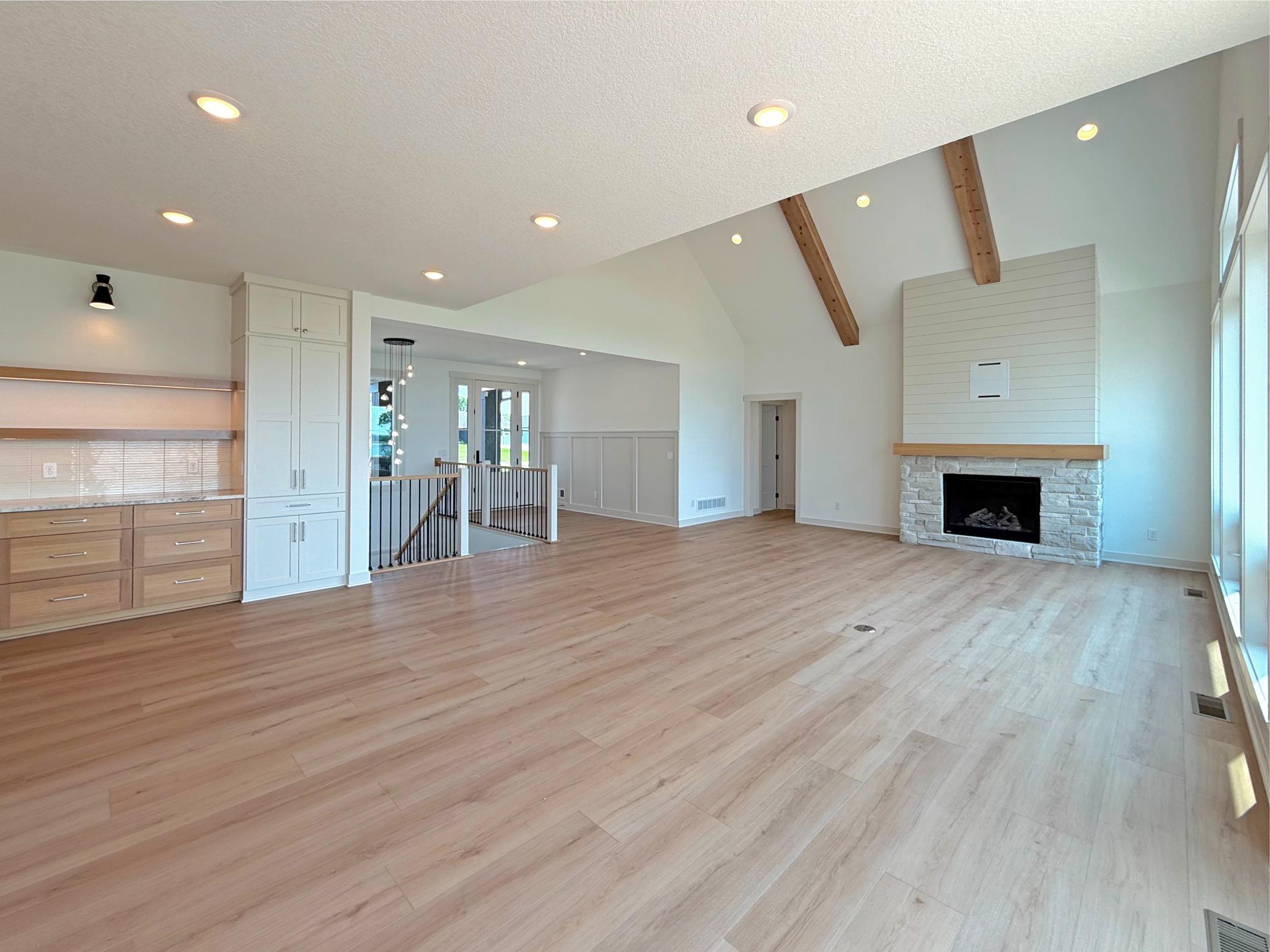Whether hosting family gatherings or enjoying a quiet evening by the fire, this expansive great room offers the perfect setting with its thoughtfully designed open floor plan.
