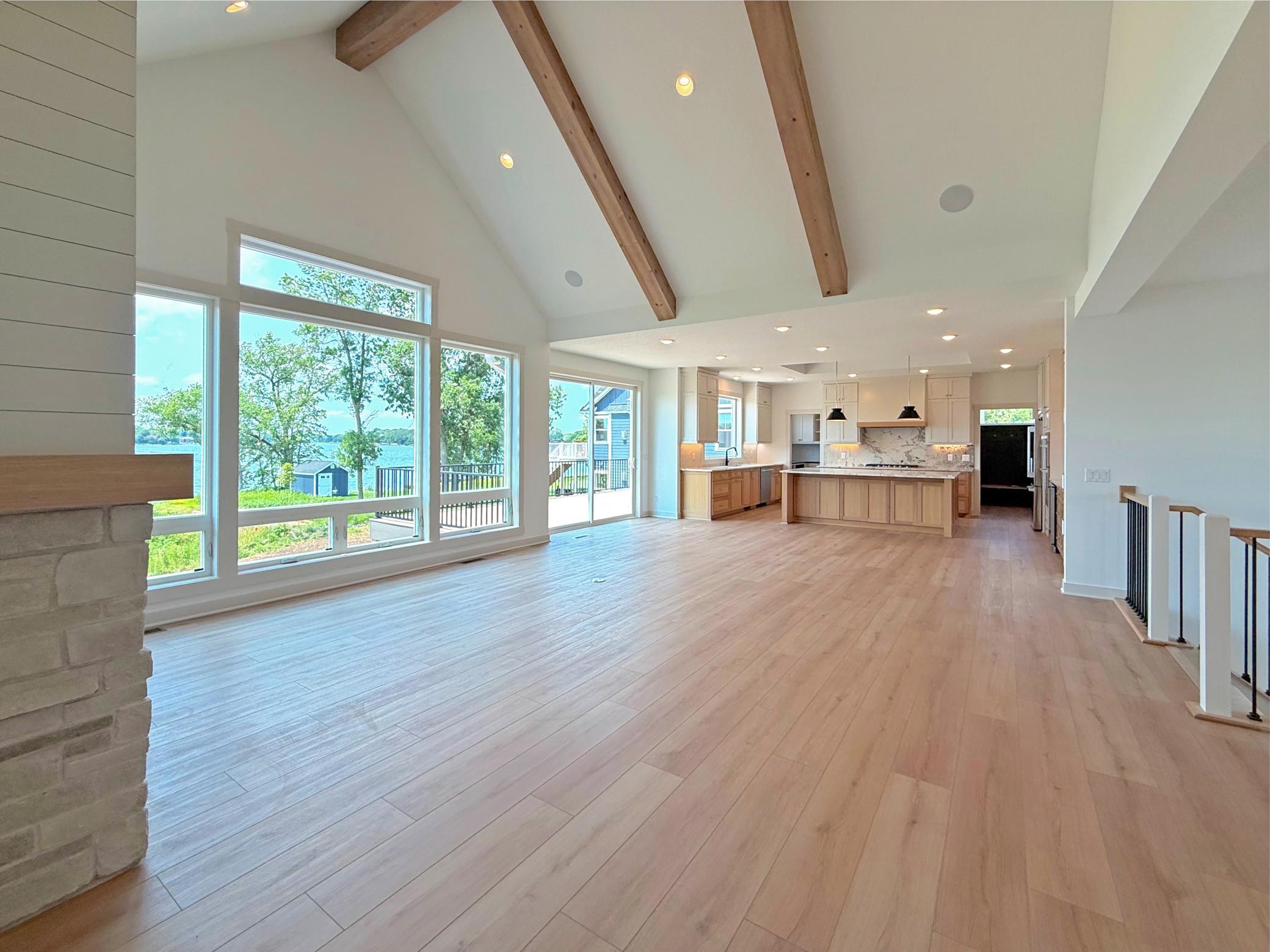 Seamlessly connected to the chef's kitchen and outdoor living spaces, this open-concept design offers an exceptional setting for gathering with family and friends.