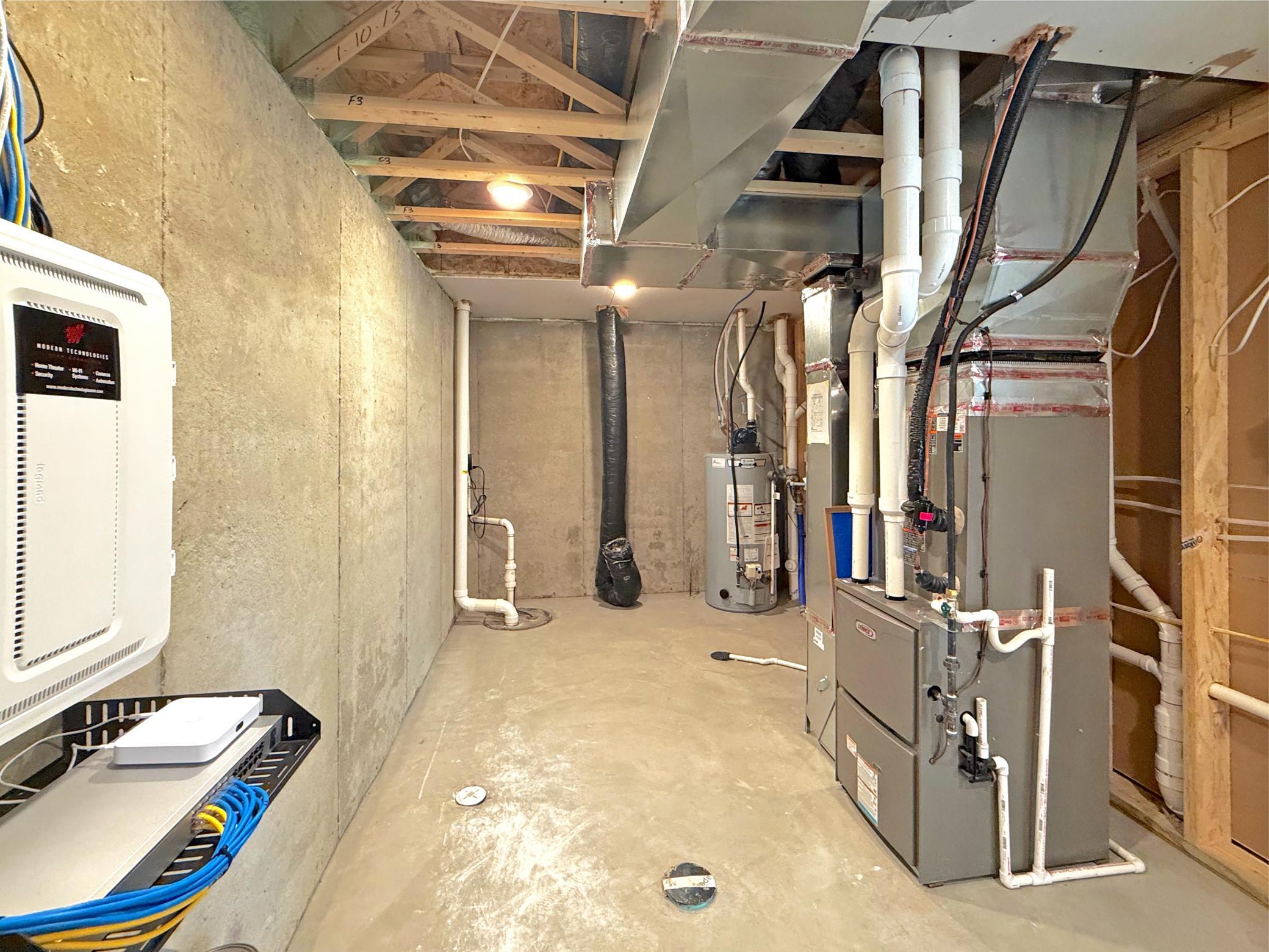 The spacious utility room houses the home's mechanical systems while providing ample storage space for seasonal items, tools, and household essentials.