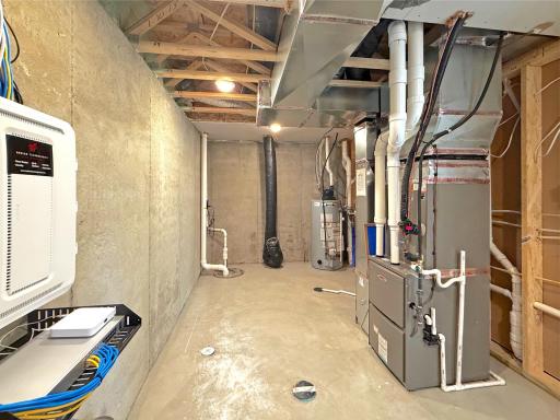 The spacious utility room houses the home's mechanical systems while providing ample storage space for seasonal items, tools, and household essentials.