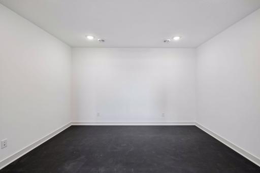 Stay active without leaving home in the dedicated exercise room, featuring French doors, durable rubber flooring and ample space for fitness equipment.