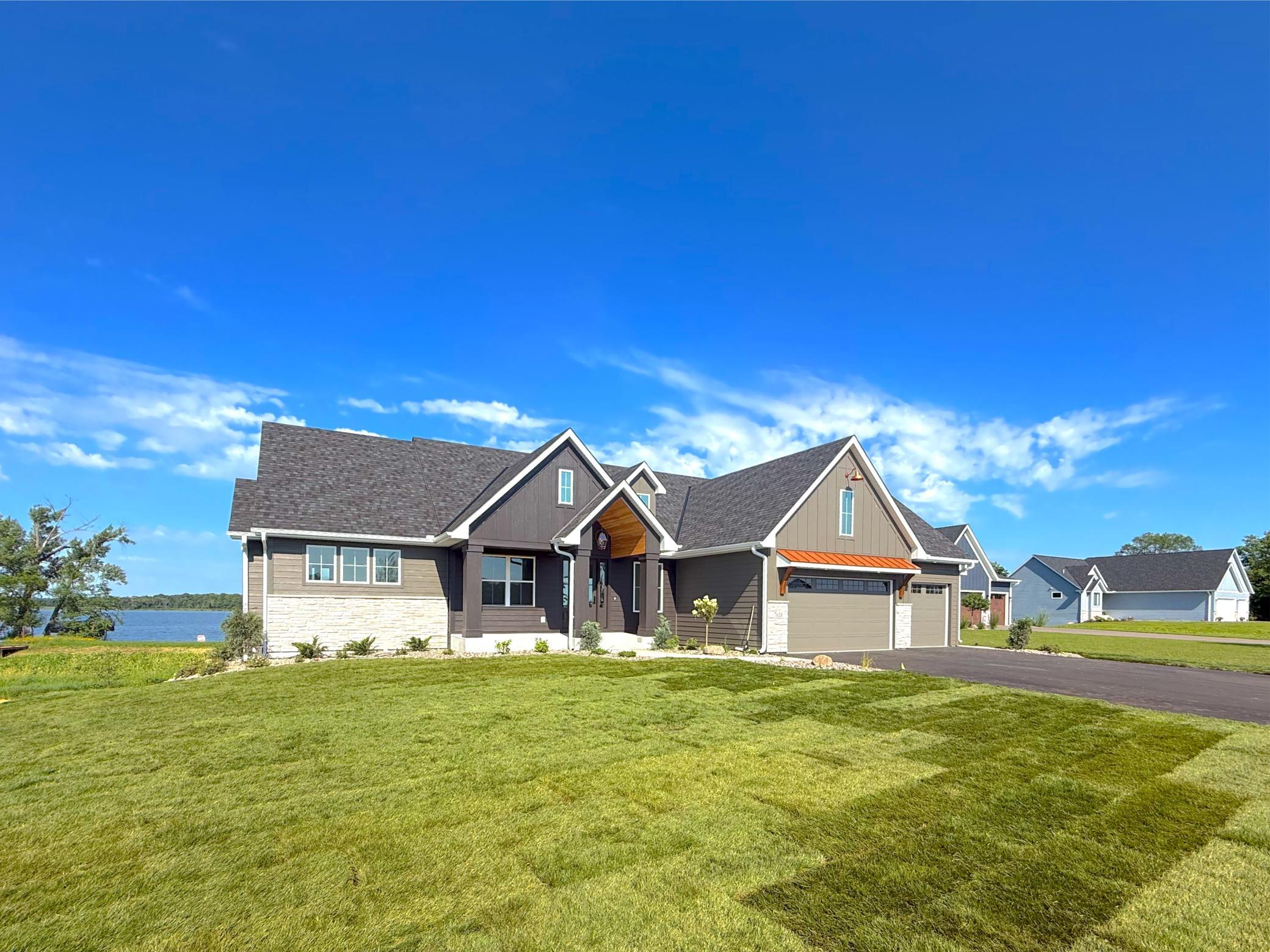 Newly finished and thoughtfully designed, this four-bedroom, three-bathroom home was built with lake life in mind with its open-concept layout and inviting gathering spaces.