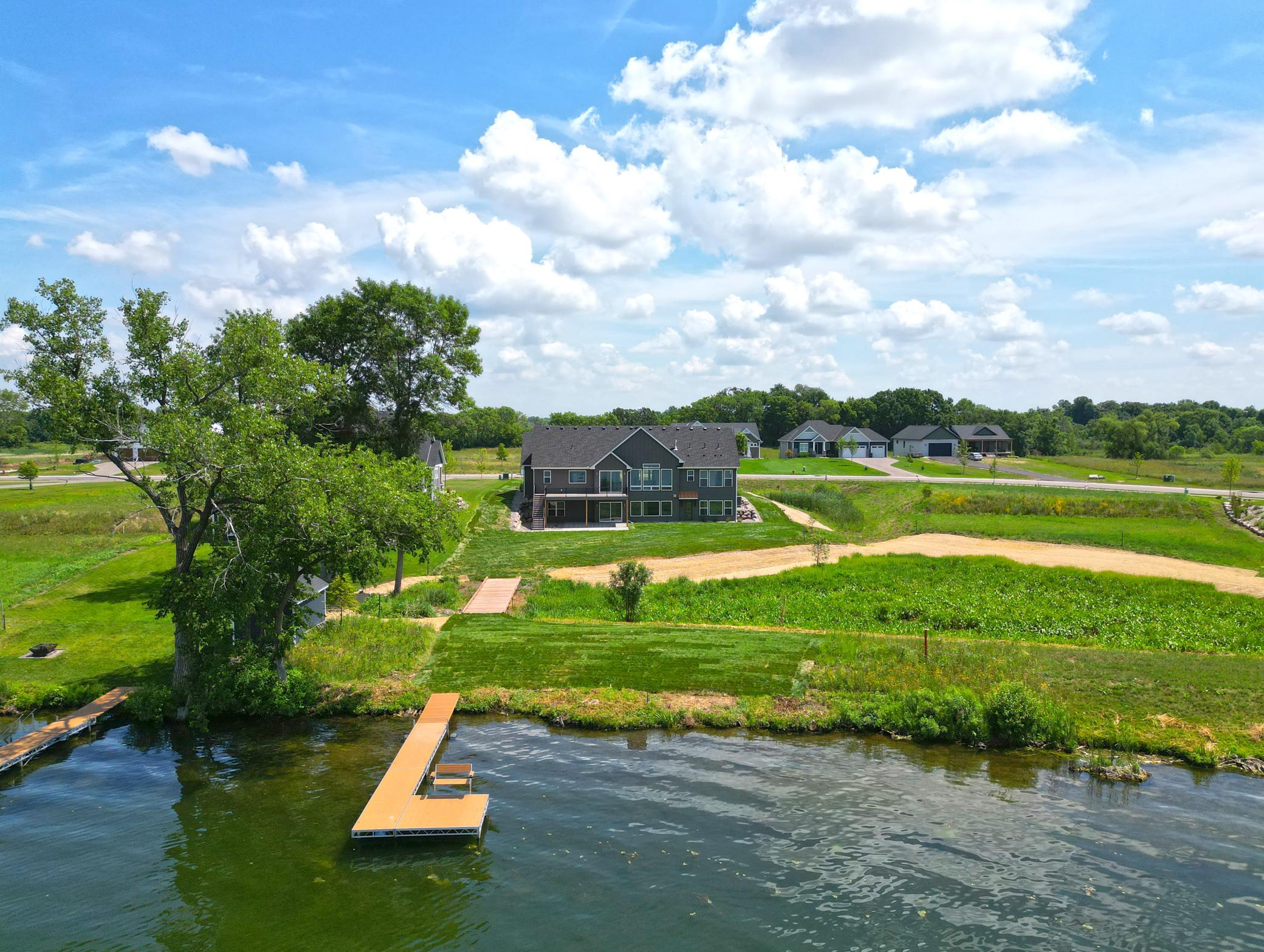 Newly completed and perfectly positioned on the water, this stunning lakeside home offers gorgeous views, and an unbeatable setting in one of the area's premier new neighborhoods.