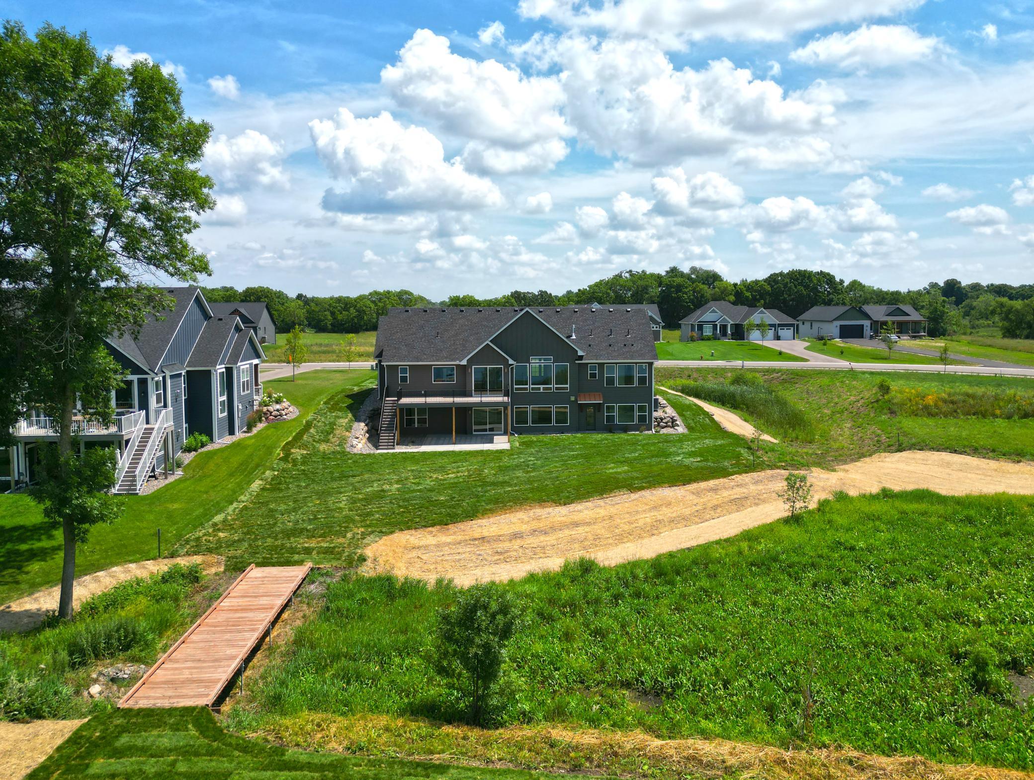 Enjoy a level backyard that gently leads to the water's edge, complete with a private dock ready for endless days on the lake.