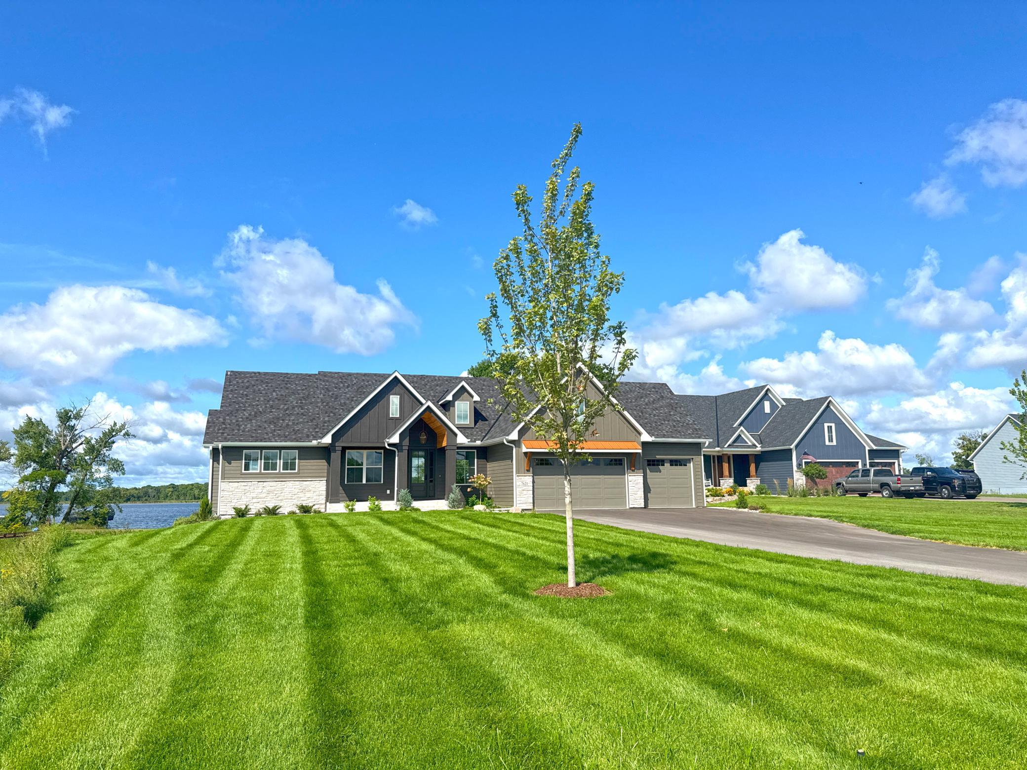 Newly finished and thoughtfully designed, this four-bedroom, three-bathroom home was built with lake life in mind with its open-concept layout and inviting gathering spaces.